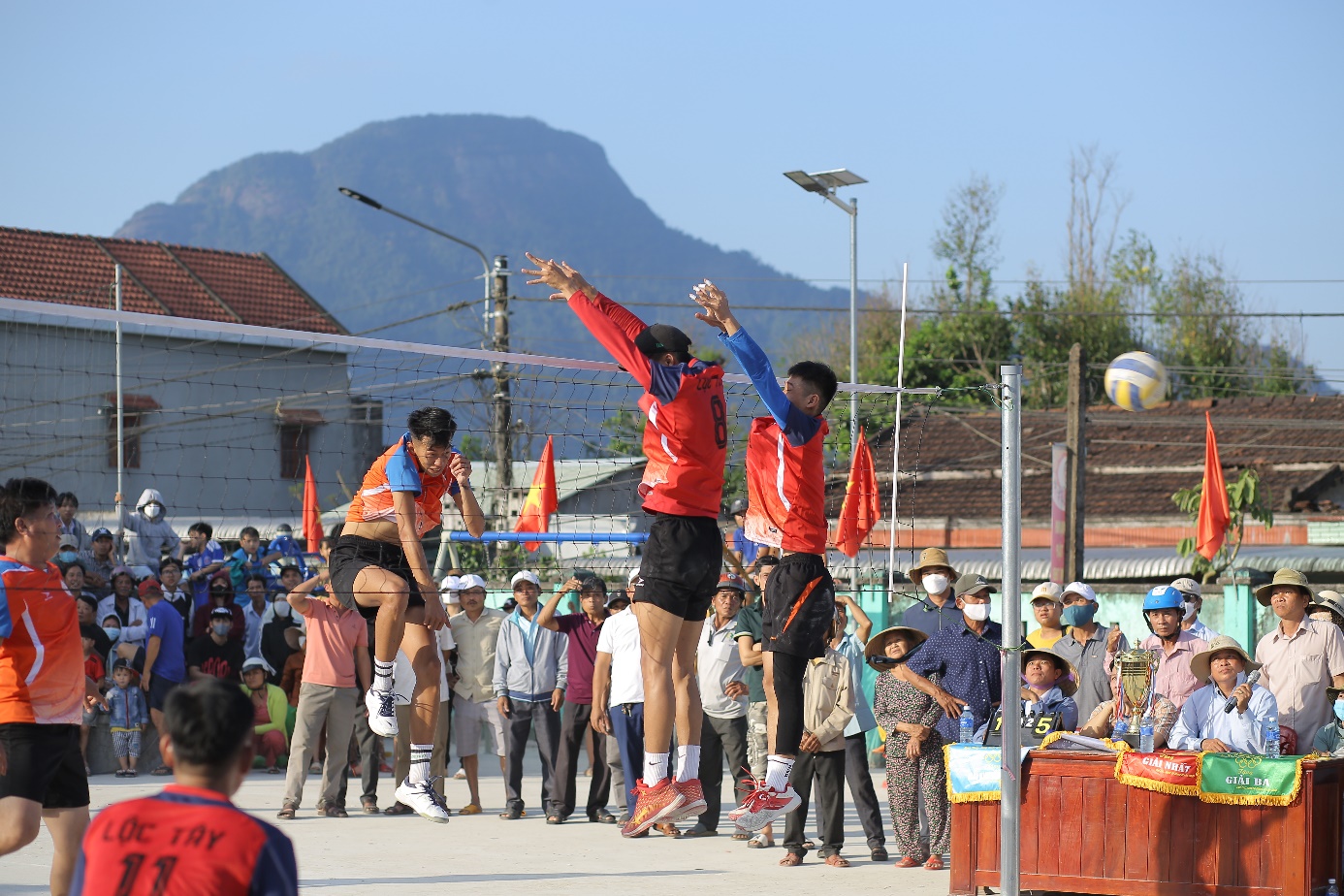 A group of people jumping in the air Description automatically generated