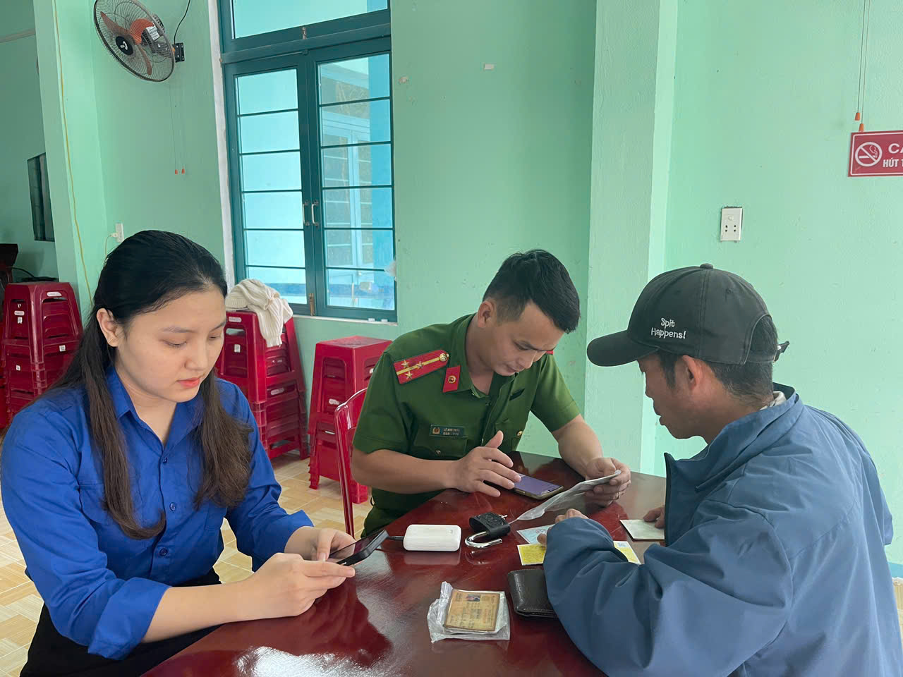 A group of people sitting at a table
Description automatically generated