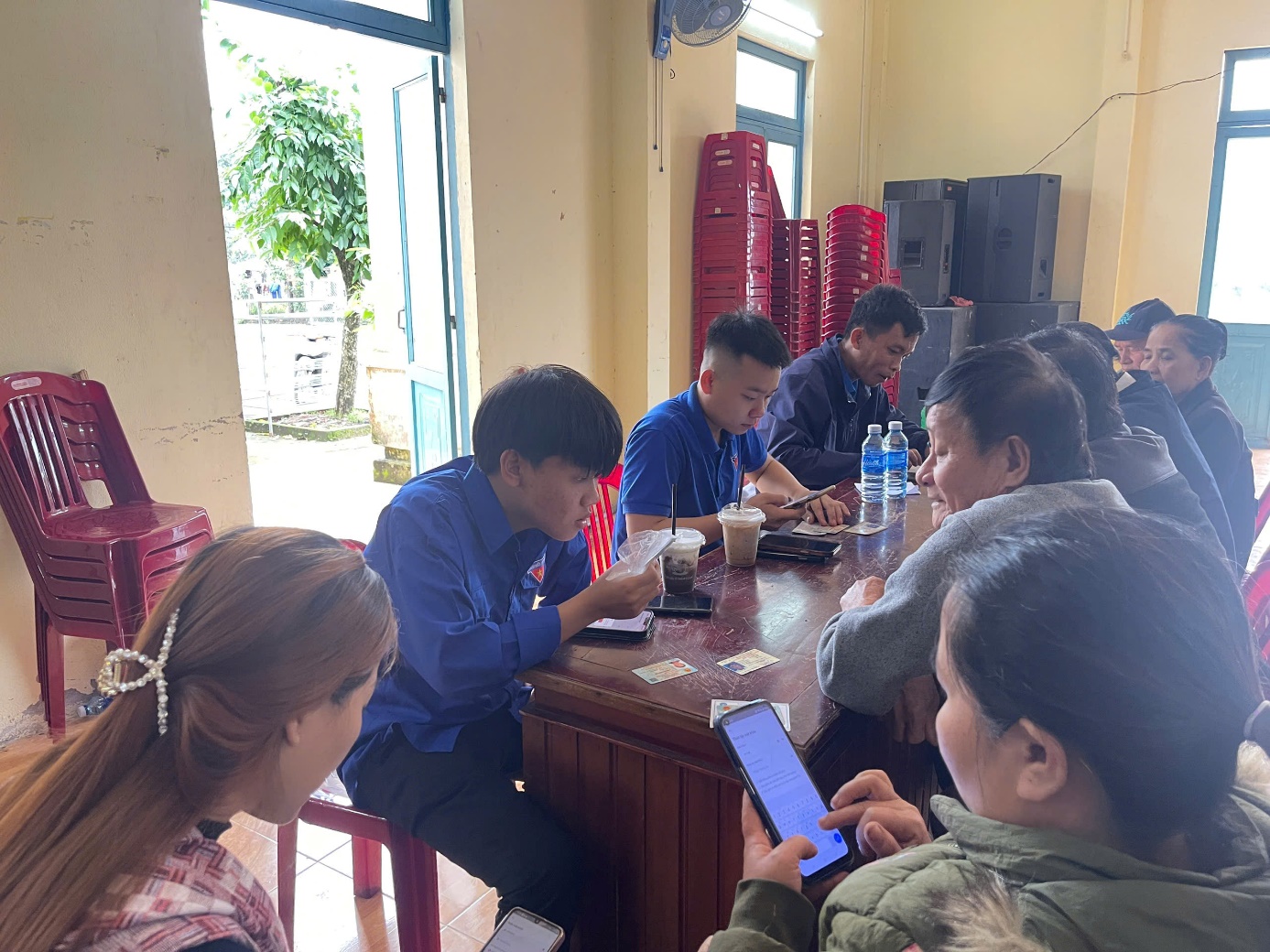 A group of people sitting at a table

Description automatically generated