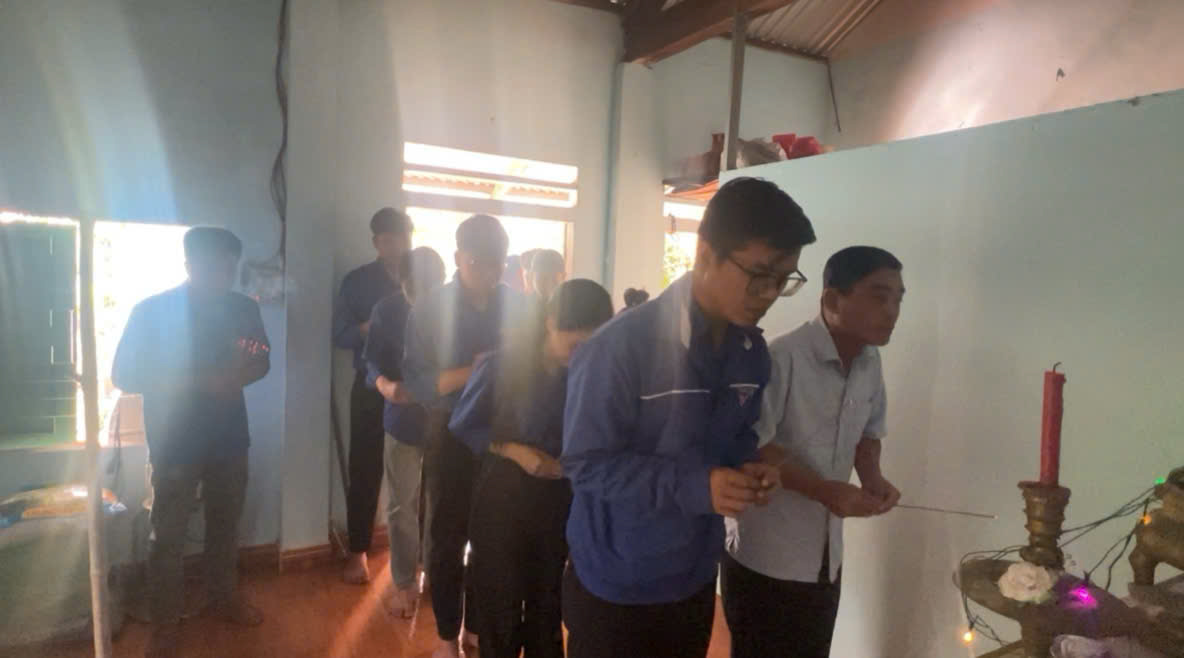 A group of people standing in a line Description automatically generated