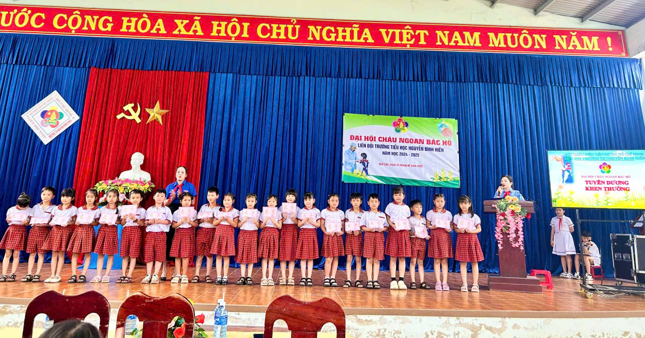 A group of children on a stage Description automatically generated